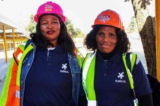 Two women in Sasol personal protective equipment on site